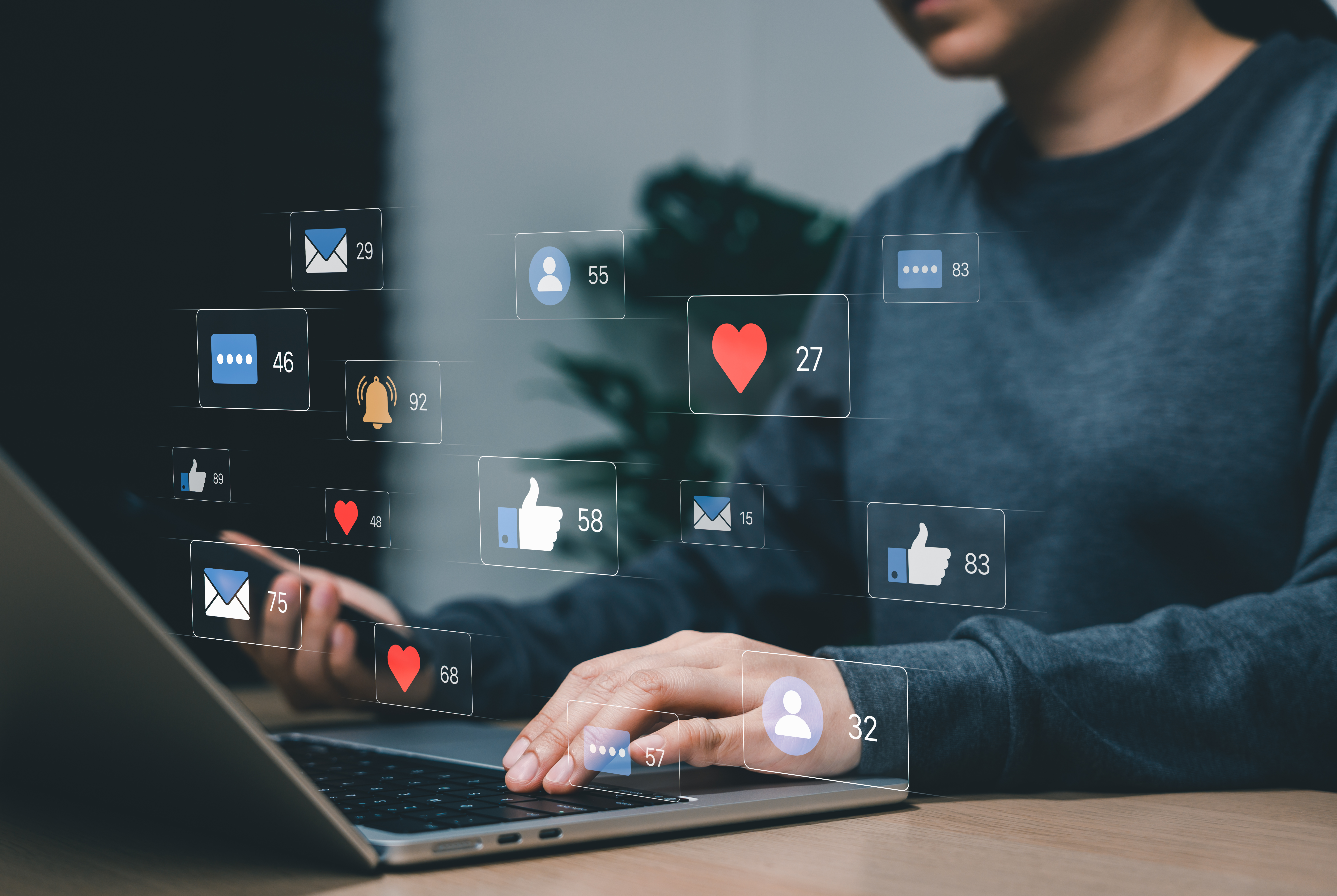 Social media engagement concept. Woman using laptop and virtual notification icons for digital marketing, online communication, audience interaction, content strategy, analytics, and networking.